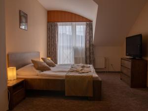 Postel nebo postele na pokoji v ubytování Hotel Pizzeria Istria