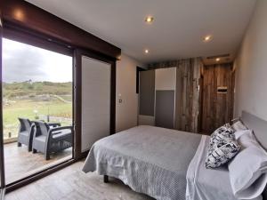 Кровать или кровати в номере Caracola de Cabo Home