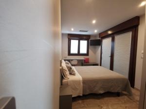 Кровать или кровати в номере Caracola de Cabo Home