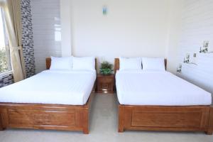 Postel nebo postele na pokoji v ubytování Da Lat Ngoi Sao Viet