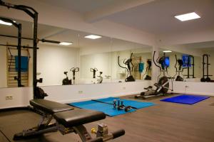a gym with several exercise bikes and a mirror at Alter Gutshof Papstdorf in Papstdorf