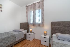 Posteľ alebo postele v izbe v ubytovaní Apartman Paty&Inky