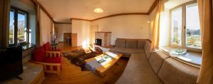 a living room with a couch and a table at Magical Family Home 84 in Bohinj