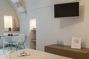 Televízia a/alebo spoločenská miestnosť v ubytovaní Casa Cristina by Wonderful Italy