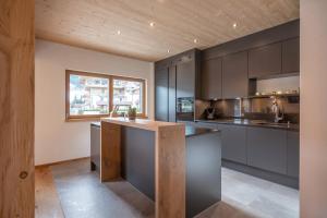 Eldhús eða eldhúskrókur á Alpenchalet "DAHOAM"