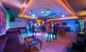 a group of people dancing in a room at Museum Hotel Antique Roman Palace - Adults Only Ultra All Inclusive in Alanya