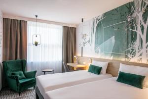 ibis Styles Kraków East客房内的一张或多张床位
