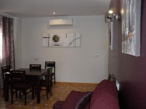 a living room with a couch and a table at Alcaidia De Magina in Cambil