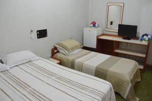 Gulta vai gultas numurā naktsmītnē Hotel Novo Tamburi
