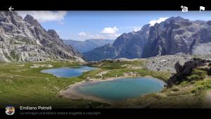 a view of two lakes in a mountain valley at Casa di Tea in Pieve di Cadore