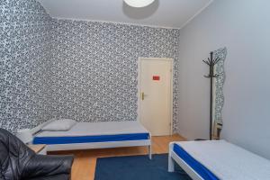 Posteľ alebo postele v izbe v ubytovaní Hostel Universus