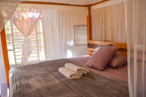 Postel nebo postele na pokoji v ubytování Villas Ecotucan