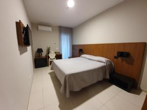 Postel nebo postele na pokoji v ubytování Hotel Casale dei Greci