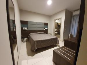 Postel nebo postele na pokoji v ubytování Hotel Casale dei Greci