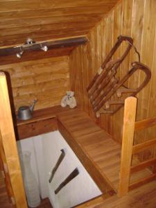 a small wooden cabin with a sink in it at fleur de neige in Gilly-sur-Isère