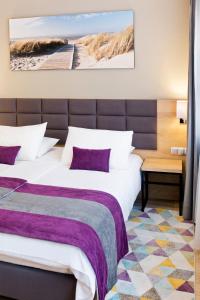 Posteľ alebo postele v izbe v ubytovaní Hotel CONRAD Comfort