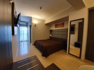 Postel nebo postele na pokoji v ubytování Hotel Casale dei Greci