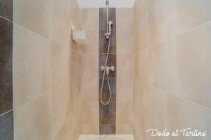 a bathroom with a shower with a glass door at Comfy 1 bedroom close to the station - Dodo et Tartine in Toulon