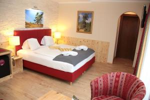 Postel nebo postele na pokoji v ubytování Genusshotel Almrausch