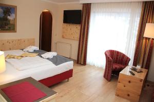 Postel nebo postele na pokoji v ubytování Genusshotel Almrausch