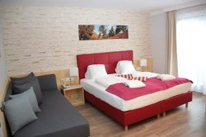 Postel nebo postele na pokoji v ubytování Genusshotel Almrausch