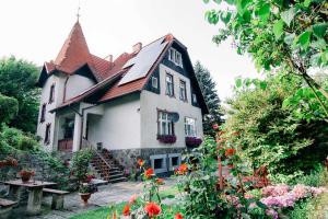 a large house with a garden in front of it at Staszica16 in Złoty Stok