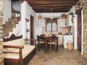 a kitchen with a table and a dining room at Anastasia Luxury Villas in Gavrio
