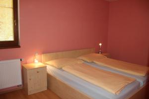 two beds in a room with two lights on them at Villa Park Lipno-Lipno-In in Lipno nad Vltavou