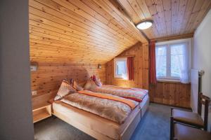 Uma cama ou camas num quarto em Chalet Alpenruh