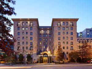 a large brick building on a city street at The Jefferson Hotel in Washington, D.C.