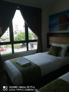 Tempat tidur dalam kamar di Yeob Bay hotel Ampang