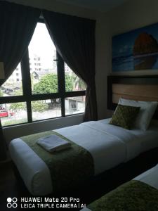 Postel nebo postele na pokoji v ubytování Yeob Bay hotel Ampang