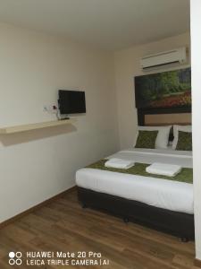 Postel nebo postele na pokoji v ubytování Yeob Bay hotel Ampang