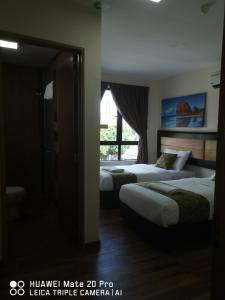 Postel nebo postele na pokoji v ubytování Yeob Bay hotel Ampang