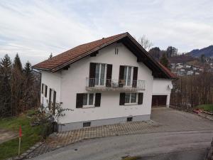 a white house with a balcony on a street at Dornbirn Hills, Bürgle 3e in Dornbirn