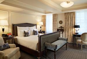 a hotel room with a bed and a chair at The Jefferson Hotel in Washington, D.C. +51 photos