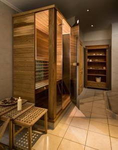 a wine cellar with a bench and a table at Atrium Agárd Panzió in Gárdony