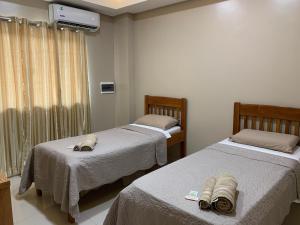 מיטה או מיטות בחדר ב-NatuCenter Hospedaje