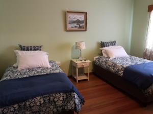 Posteľ alebo postele v izbe v ubytovaní DKC Accommodation