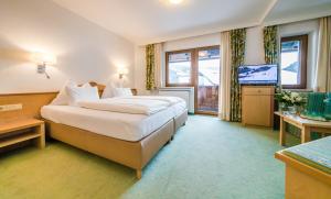 Postel nebo postele na pokoji v ubytování Hotel Sonnenheim
