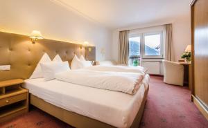 Postel nebo postele na pokoji v ubytování Hotel Sonnenheim