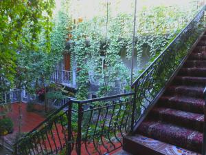 a staircase with plants on the side of a building at HOTEL Rahmon - 2 in Samarkand