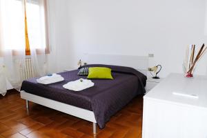 A bed or beds in a room at La Casina di Certaldo