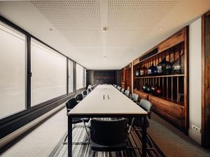 a long conference room with a long table and chairs at Bernadet Alaçatı in Alaçatı +131 photos