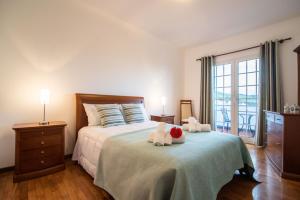 Ένα ή περισσότερα κρεβάτια σε δωμάτιο στο Ramal House