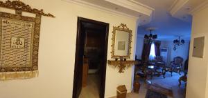 a room with a mirror and a dining room at Charming sunset,Panoramic Nile view & pyramid view in Cairo