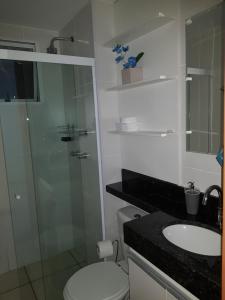 a bathroom with a shower and a toilet and a sink at Apto 3 QUARTOS NA GLORIA - 102 in Macaé