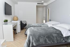Rooms at Zajčeva 34客房内的一张或多张床位
