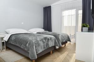 Rooms at Zajčeva 34客房内的一张或多张床位