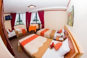 Ένα ή περισσότερα κρεβάτια σε δωμάτιο στο Hatun Samay Hotel